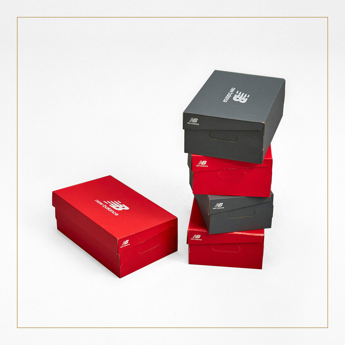 New Balance red and gray shoe boxes stacked.